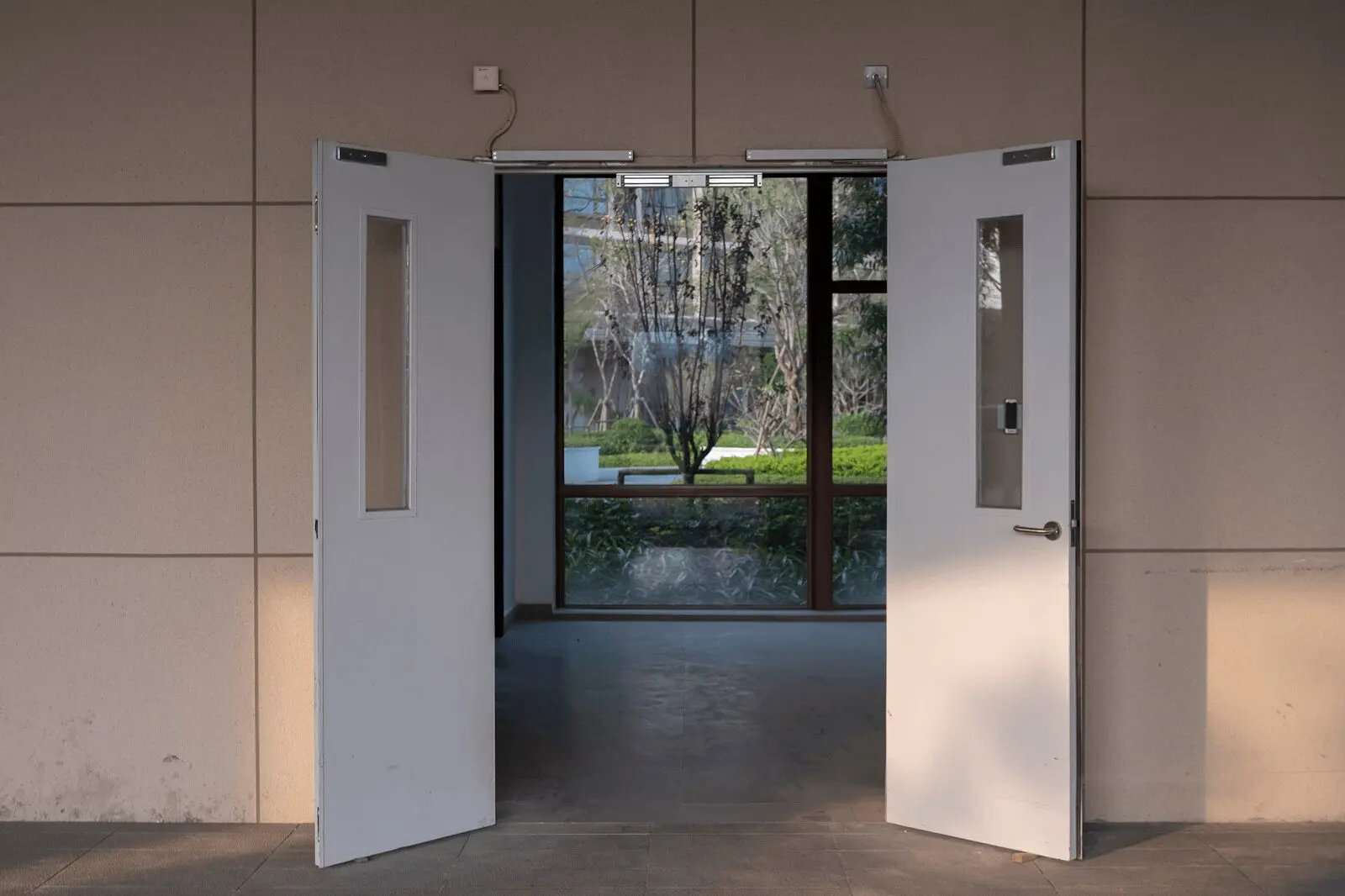 Open double doors leading to garden area.